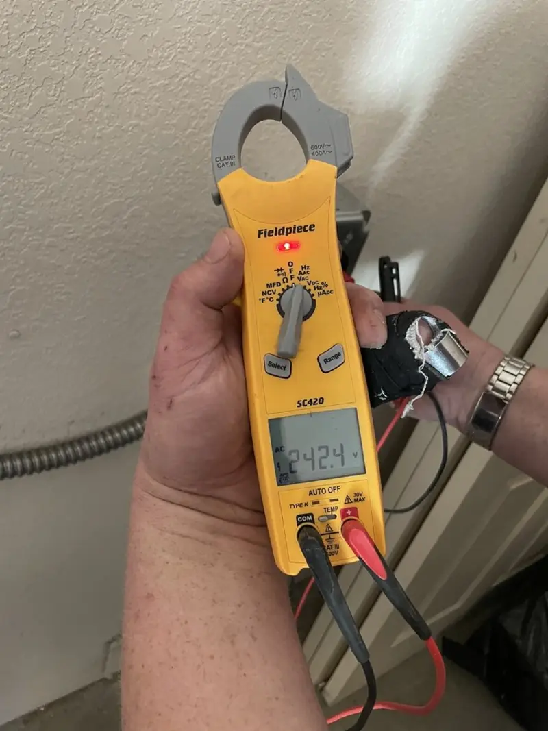 Voltage testing with clamp meter during Outlet Installation in Barton